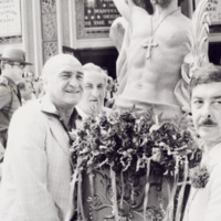 Chief Justice Joseph Bevilacqua carrying the statue of St. Bart.